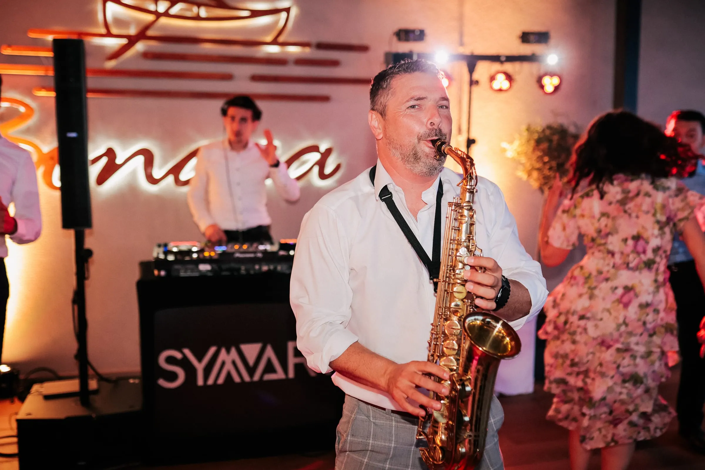 A saxophonist playing among dancing guests at Bonaca in Pula