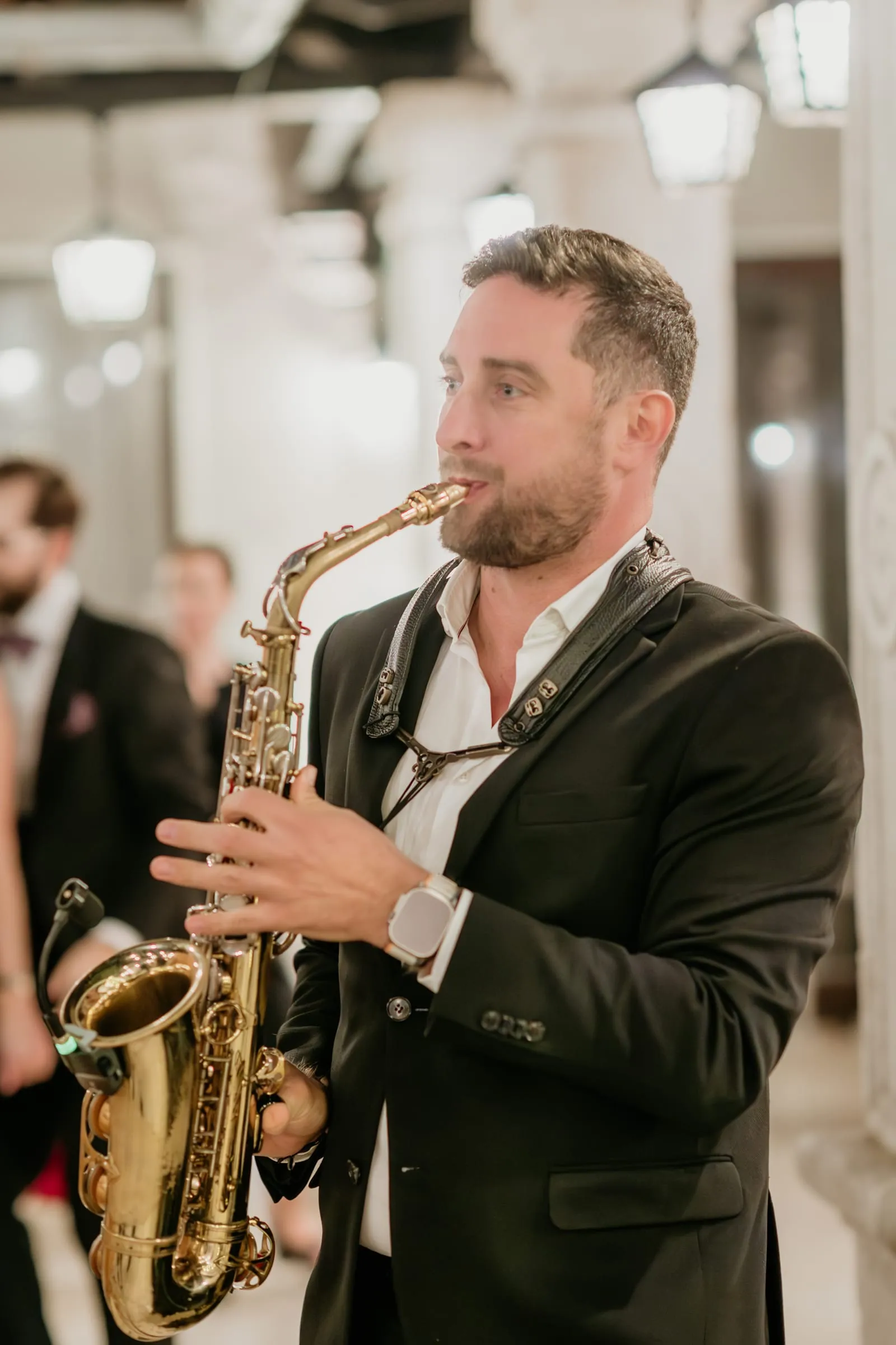 A saxophonist performing live at a wedding on Red Island